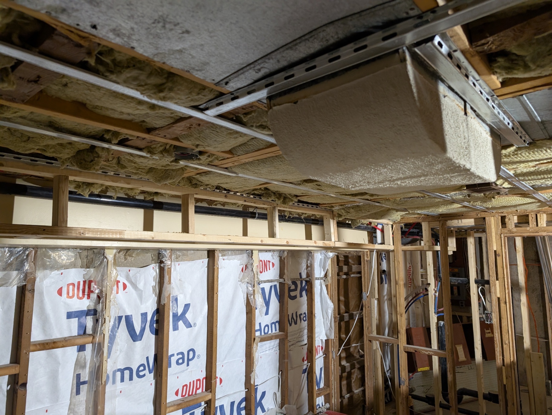 Before — Tyvek walls & exposed ceiling