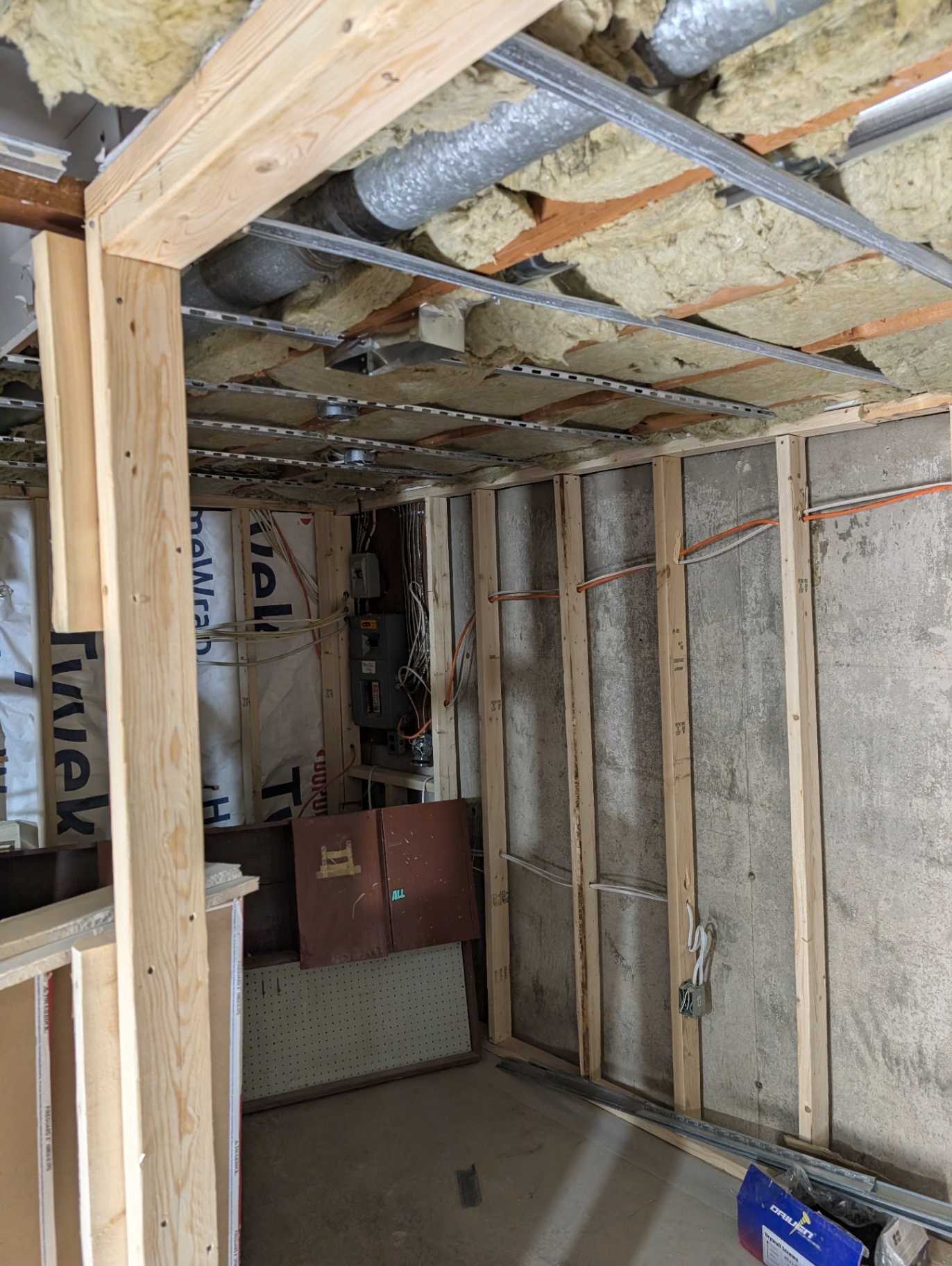 Before — utility room with electrical panel