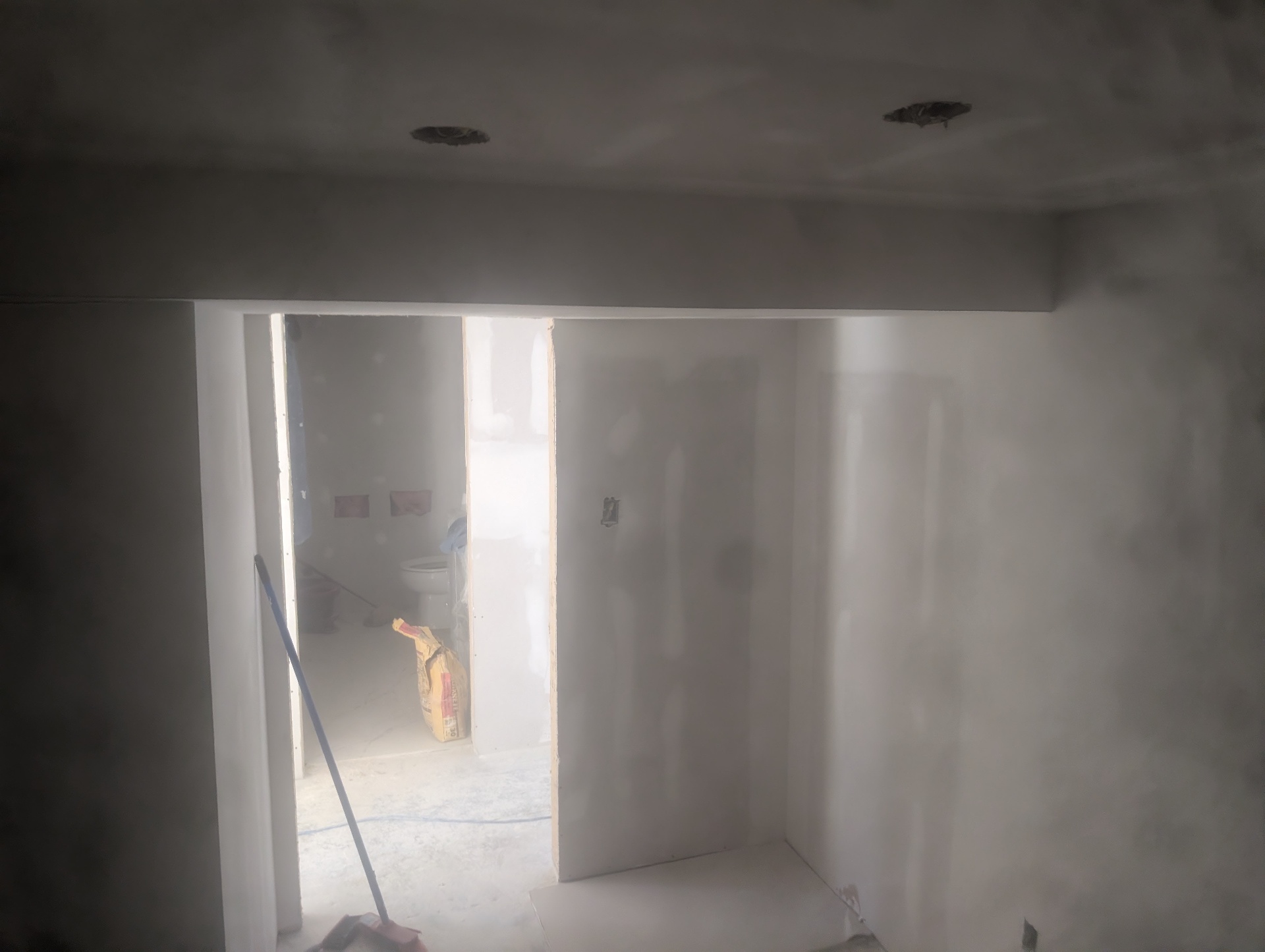 Basement bathroom entry — smooth walls