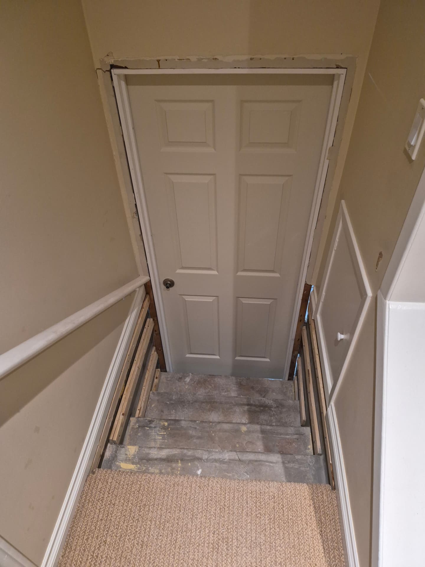 Stairwell door opening rebuilt from the top landing