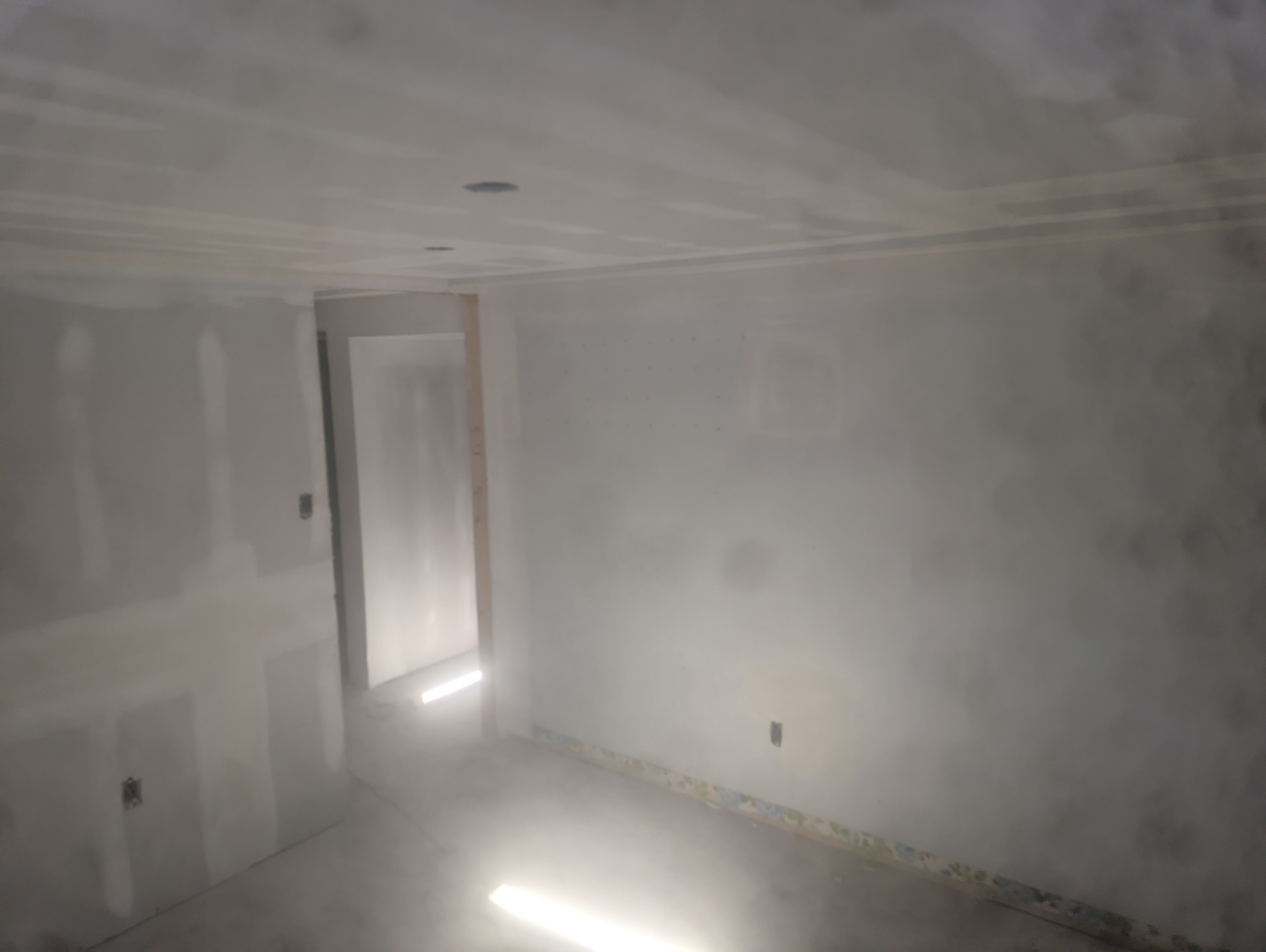 Basement bedroom sanded and ready for paint