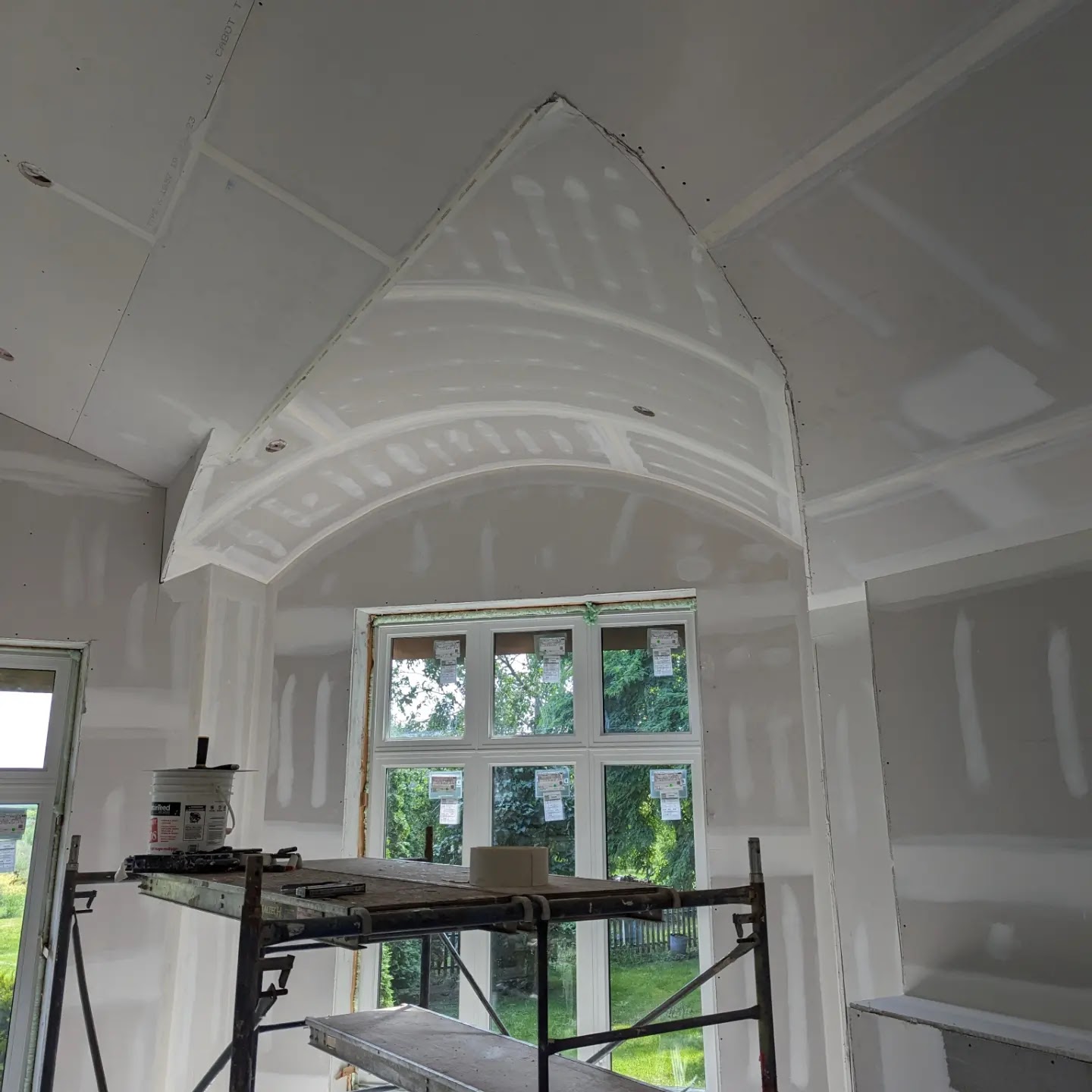 Cathedral vaulted ceiling with drywall complete