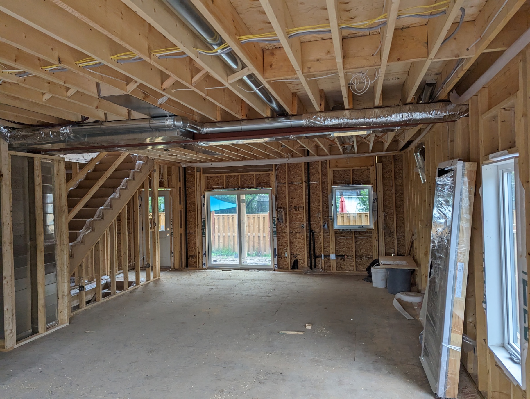 Open-concept main floor framing before drywall