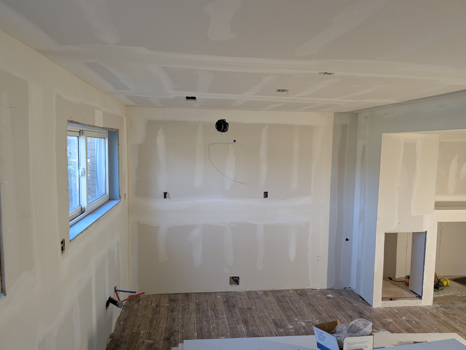 Kitchen area stripped down to drywall